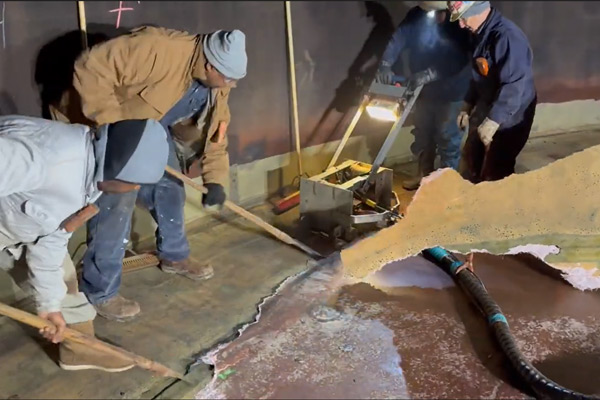 Workers removing fiberglass